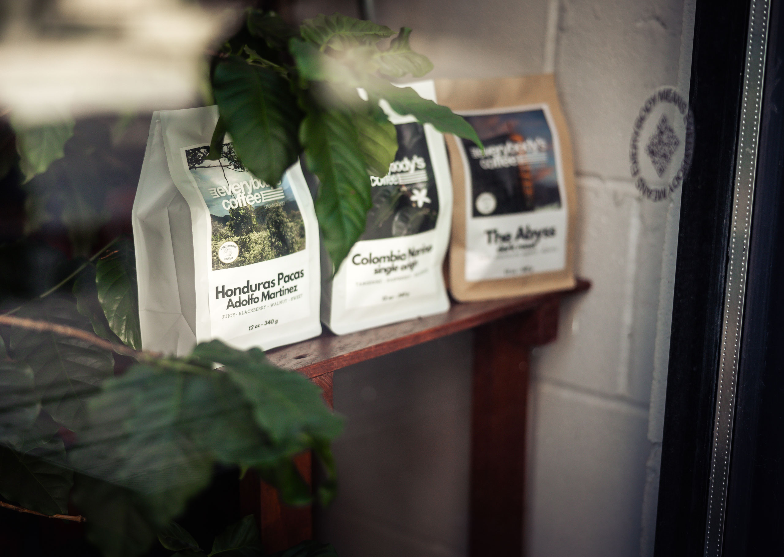 Everybody's Coffee bags in window